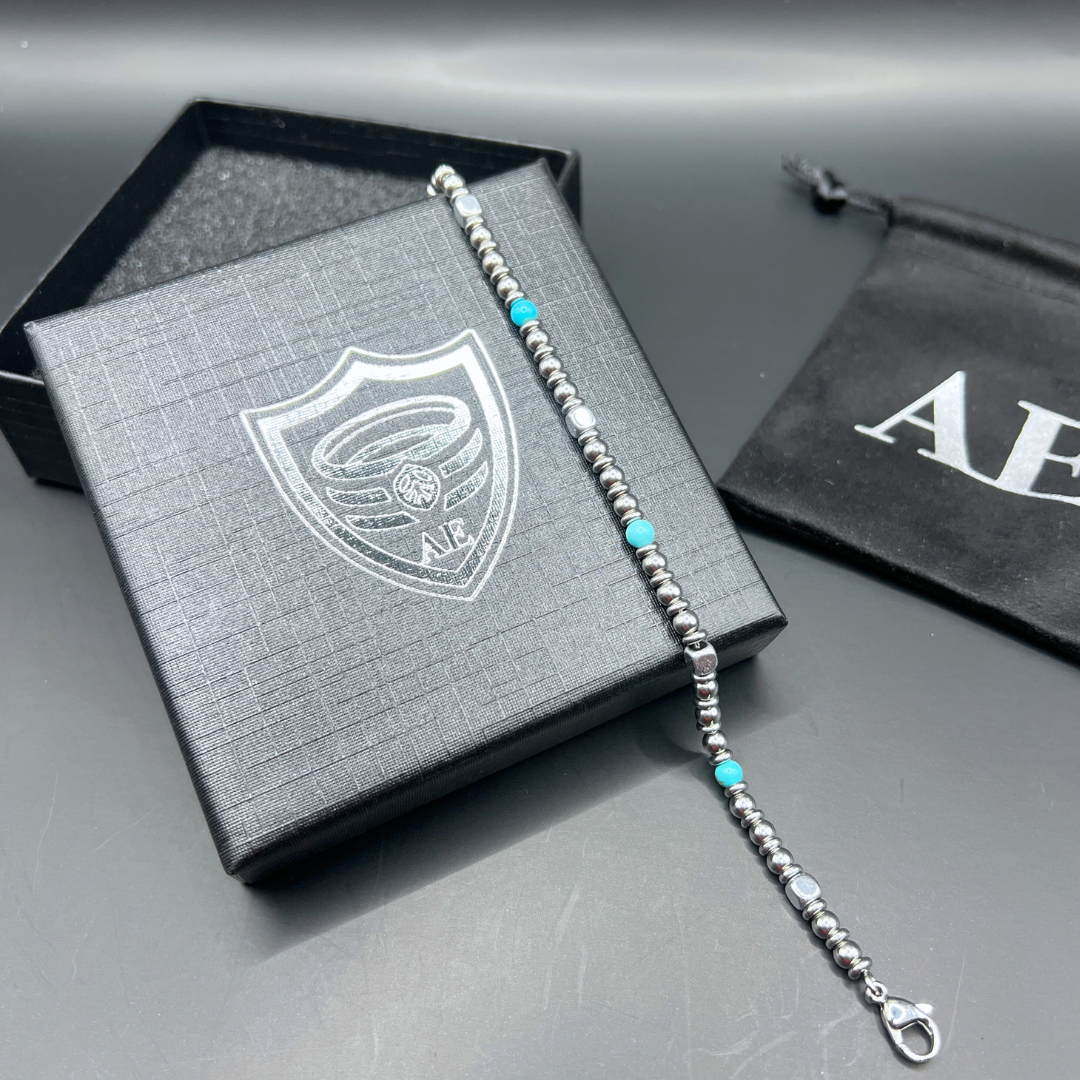 Full view of Aqua Pulse bracelet displayed on Armoured Elegance box with branded pouch