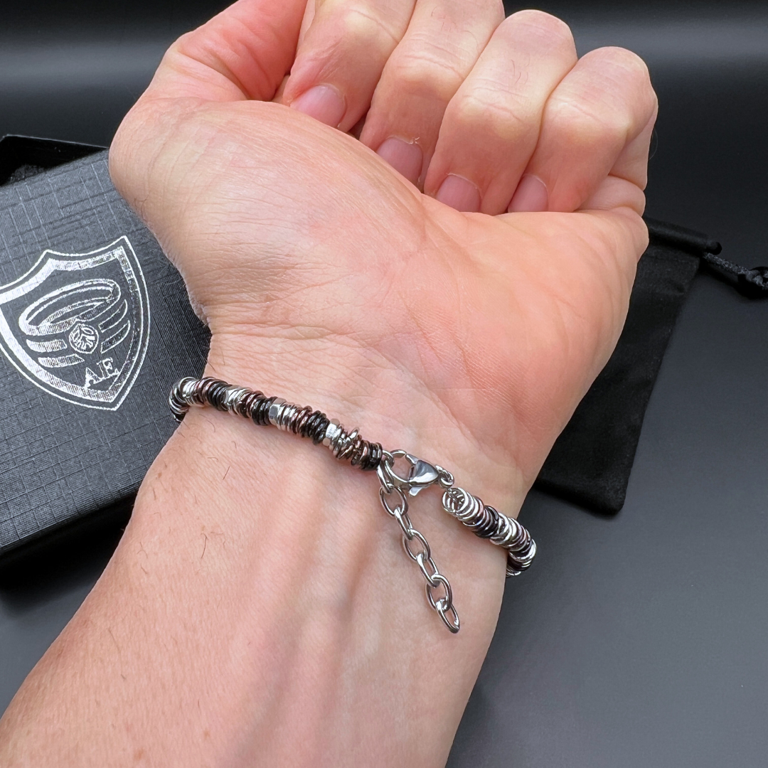 Wrist-worn Industrial Torque bracelet variant showing secure lobster clasp and stainless steel chain