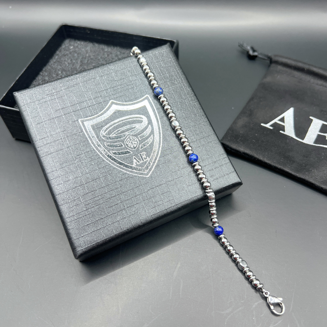 Full length of Midnight Pulse bracelet laid out on Armoured Elegance gift box