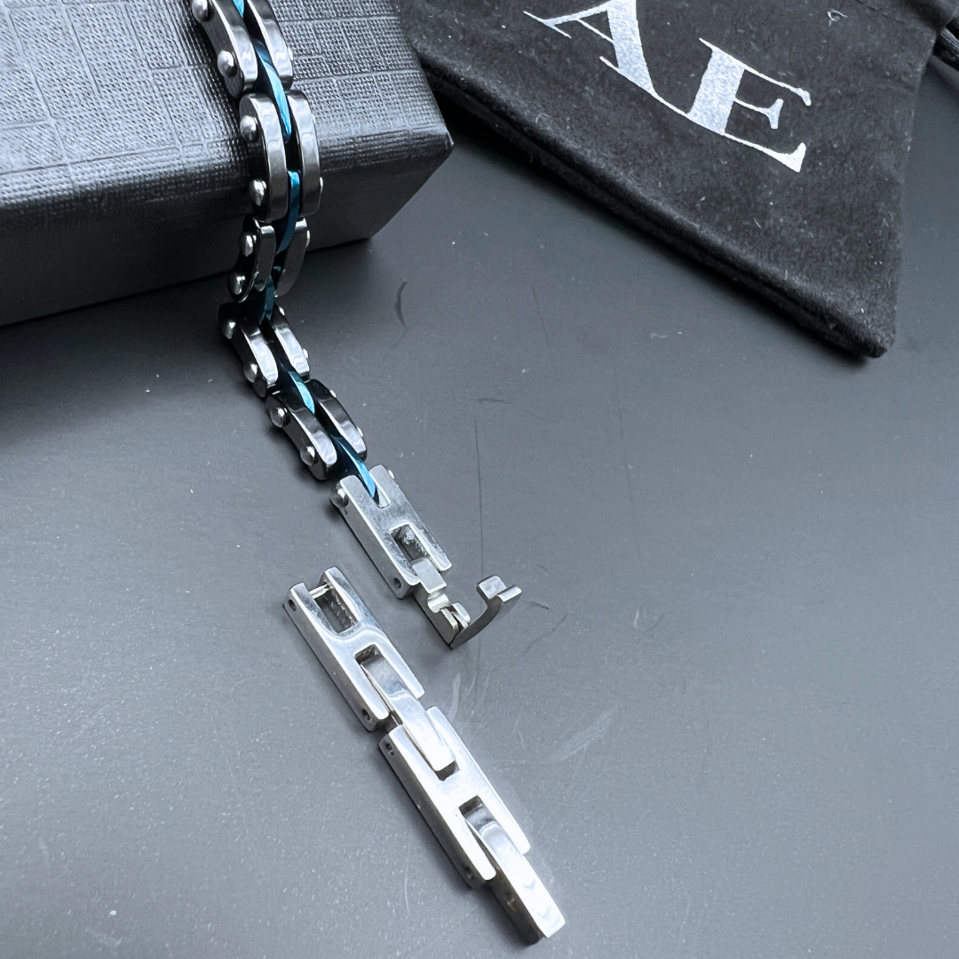 Close-up detail of Velocity Blue Surge bracelet chain link and anodised blue centre wire.