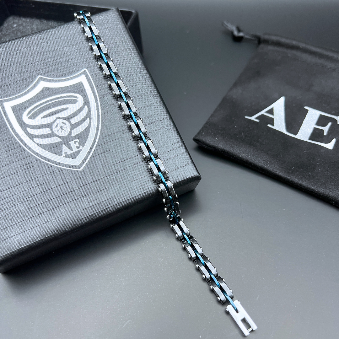 Velocity Blue Surge bracelet displayed in full length on black gift box with AE pouch.