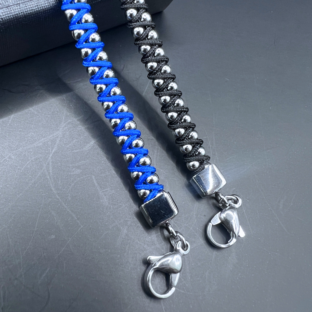 End clasp detail of the blue and black Synergy bracelets by Armoured Elegance with stainless steel finish.
