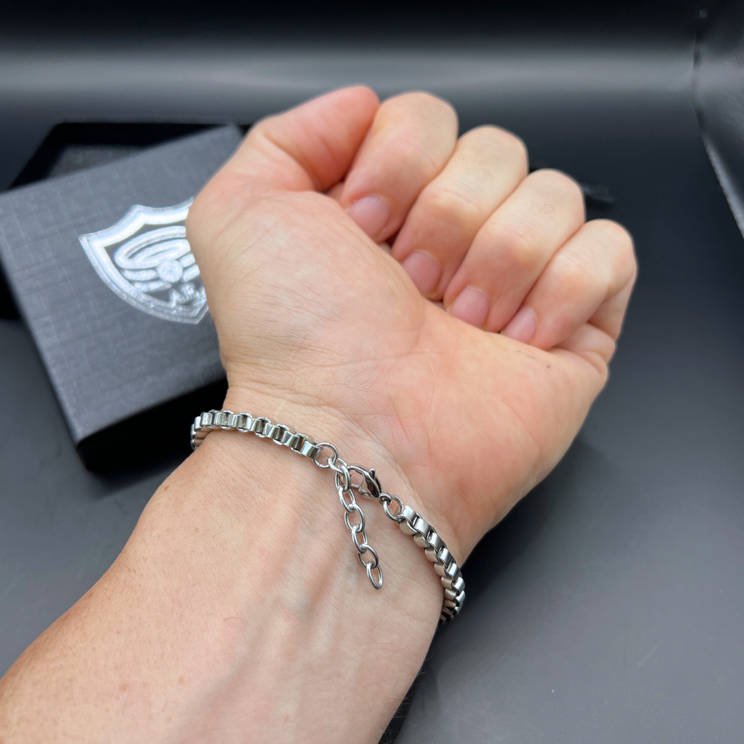 Element stainless steel box-chain bracelet worn on wrist showing adjustable extension chain.