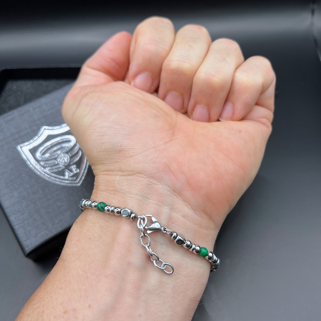 Back view of the Legion bracelet on wrist showing adjustable clasp and metal bead threading.