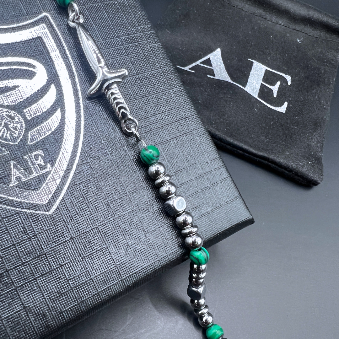 Close-up of the Legion bracelet sword centerpiece with stainless beads and green malachite stones.