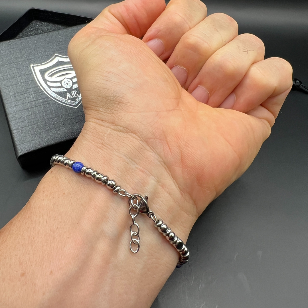Adjustable clasp detail of Midnight Pulse bracelet with chain and lobster lock on wrist