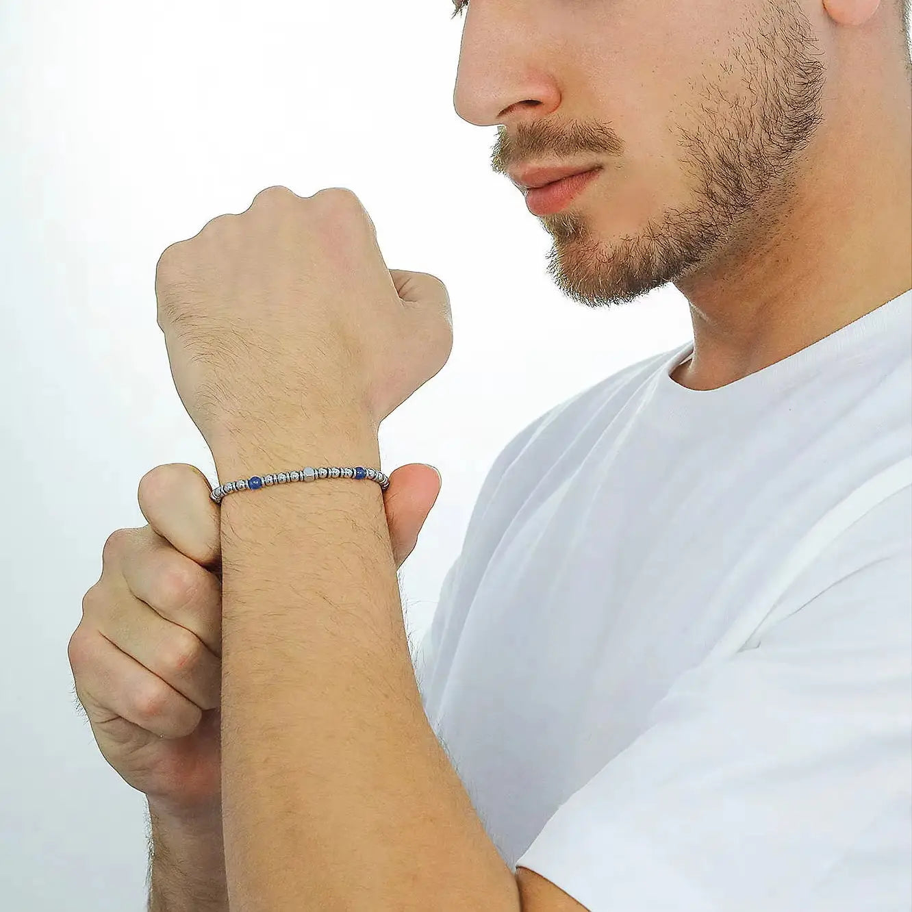 Man wearing Midnight Pulse bracelet on his wrist studio shot