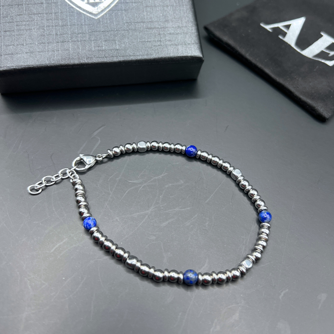 Close-up of Midnight Pulse bracelet showing stainless steel clasp and deep blue bead detail