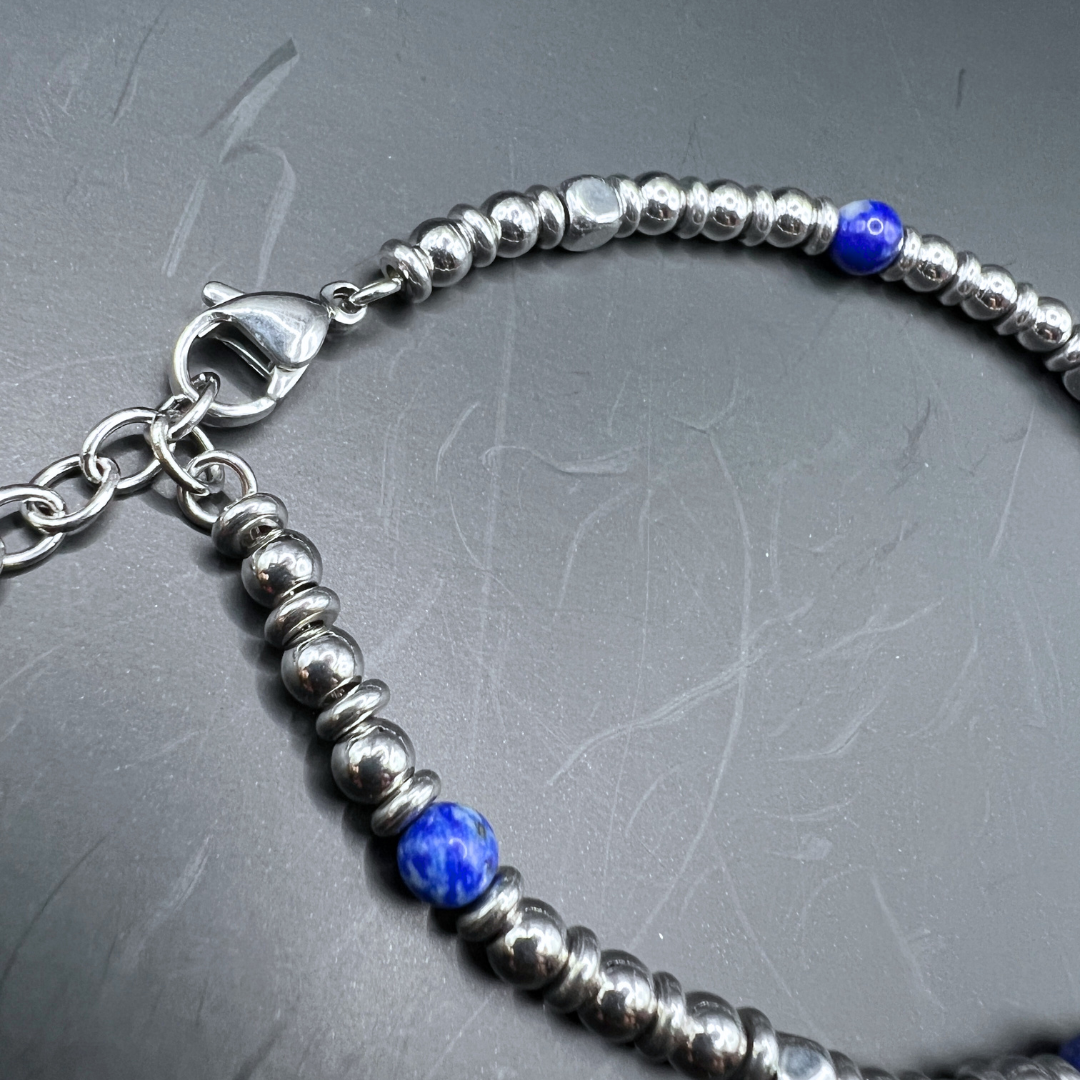 Midnight Pulse bracelet styled in loop shape with Armoured Elegance box and pouch in background