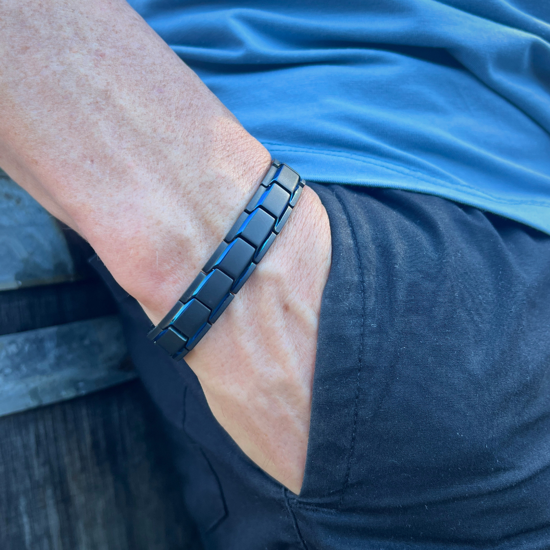 Tight close-up of the Midnight Series chain link bracelet on a man's wrist, highlighting the bold, modern black metal links with a clean, fitted look.