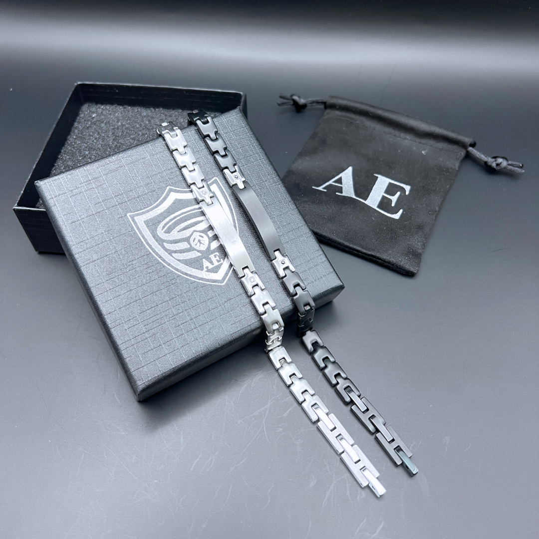 Shadow Sentinel and Steel Sentinel bracelets displayed on Armoured Elegance box showing adjustable links