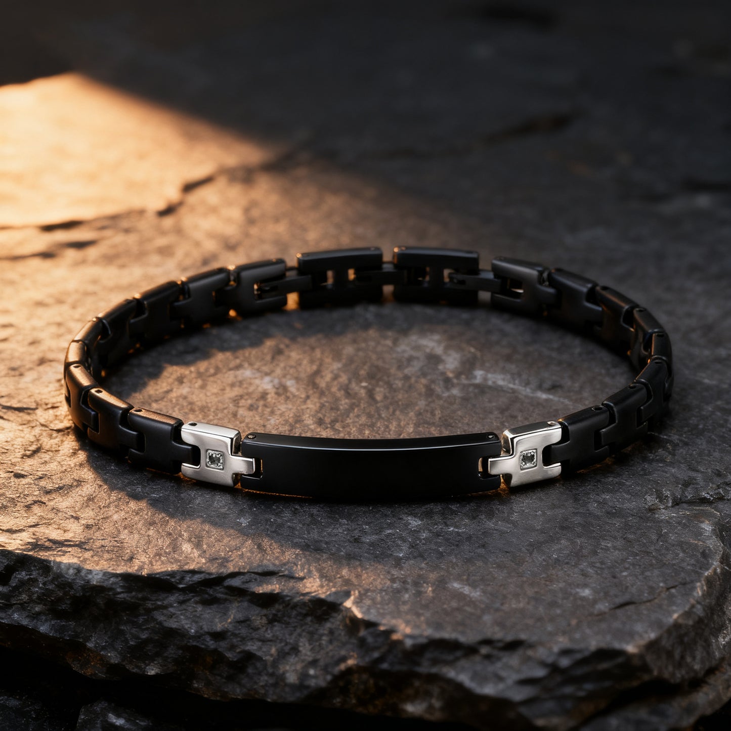 Shadow Sentinel black stainless steel bracelet on stone surface in warm lighting, rugged masculine look.
