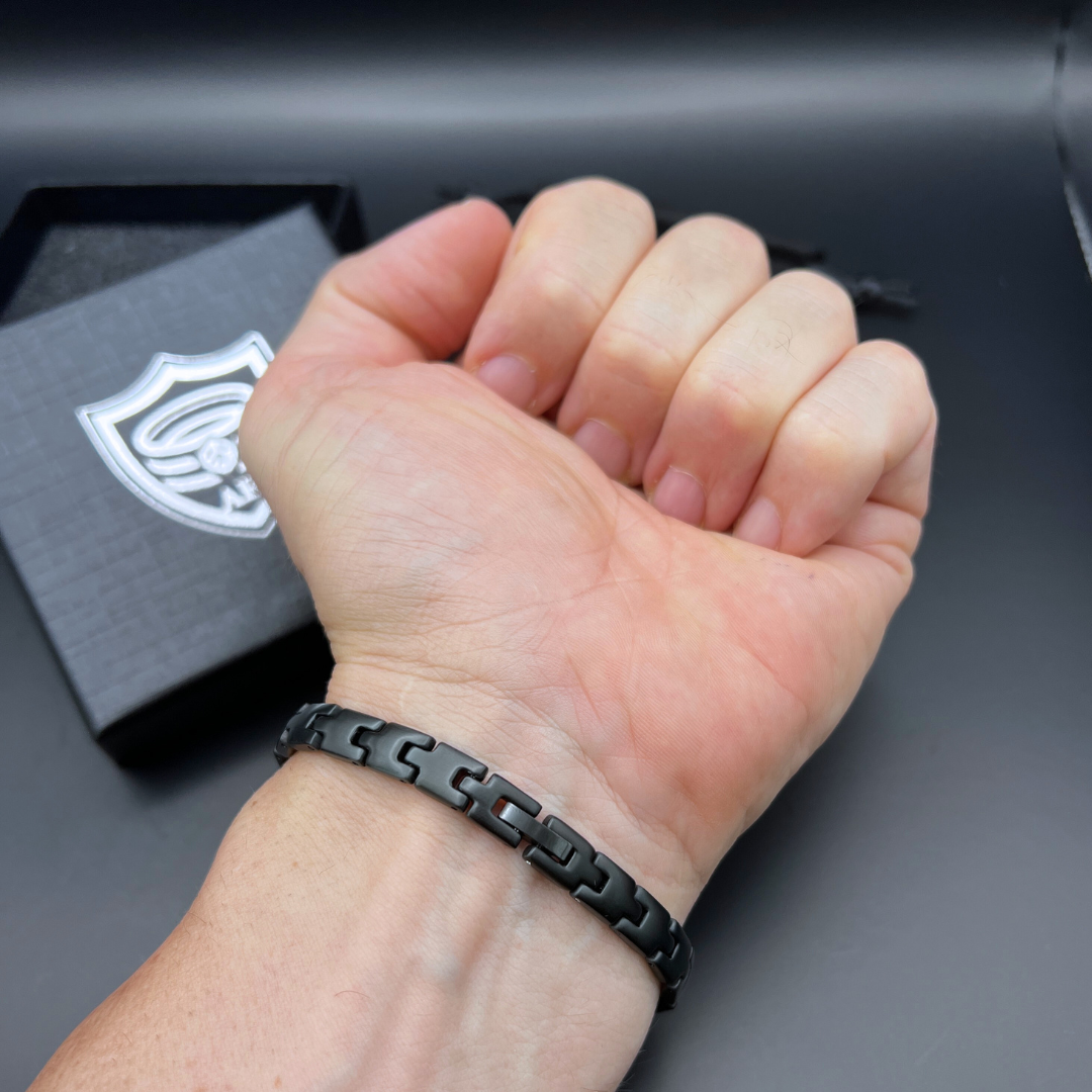 Shadow Sentinel black stainless steel bracelet worn on wrist.