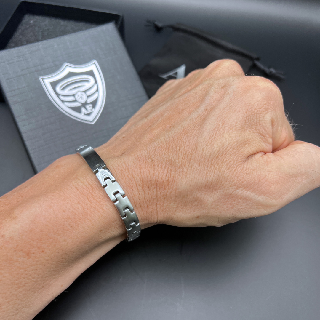 Steel Sentinel silver stainless steel bracelet on wrist with brushed centerpiece and polished link connectors