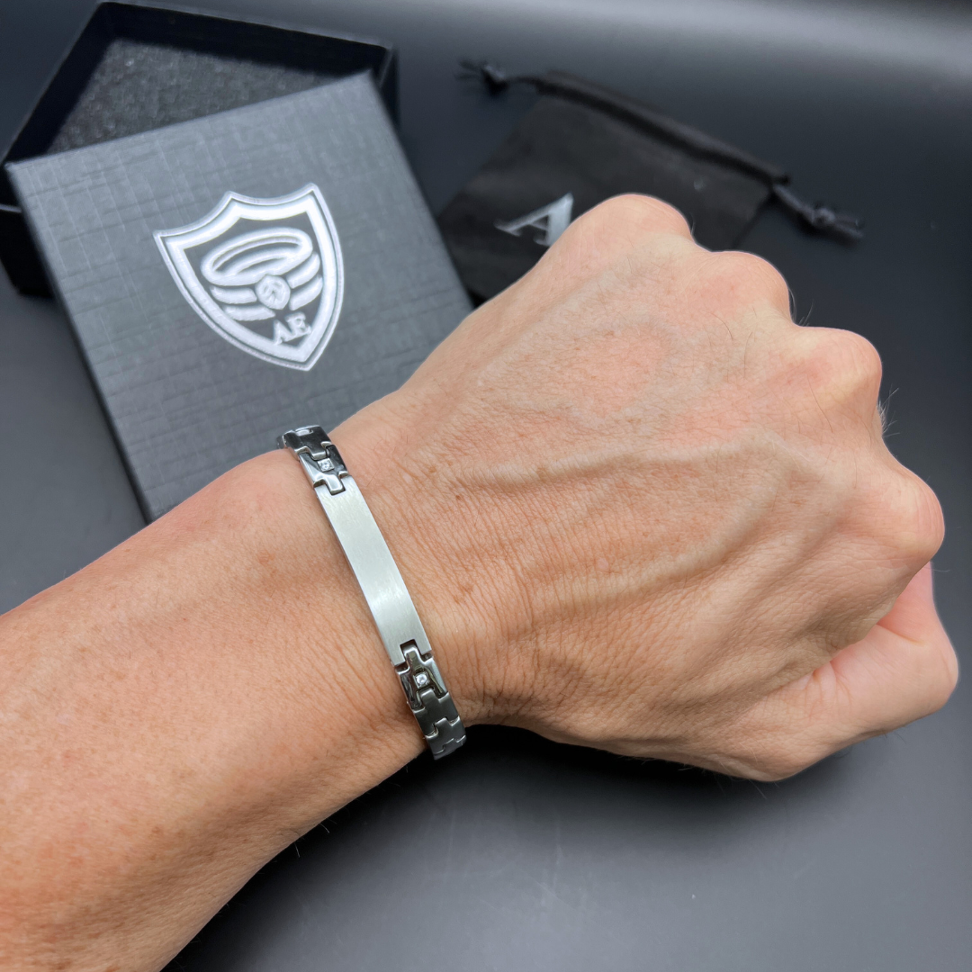 Steel Sentinel silver stainless steel bracelet on wrist highlighting flexible link chain and brushed ID plate