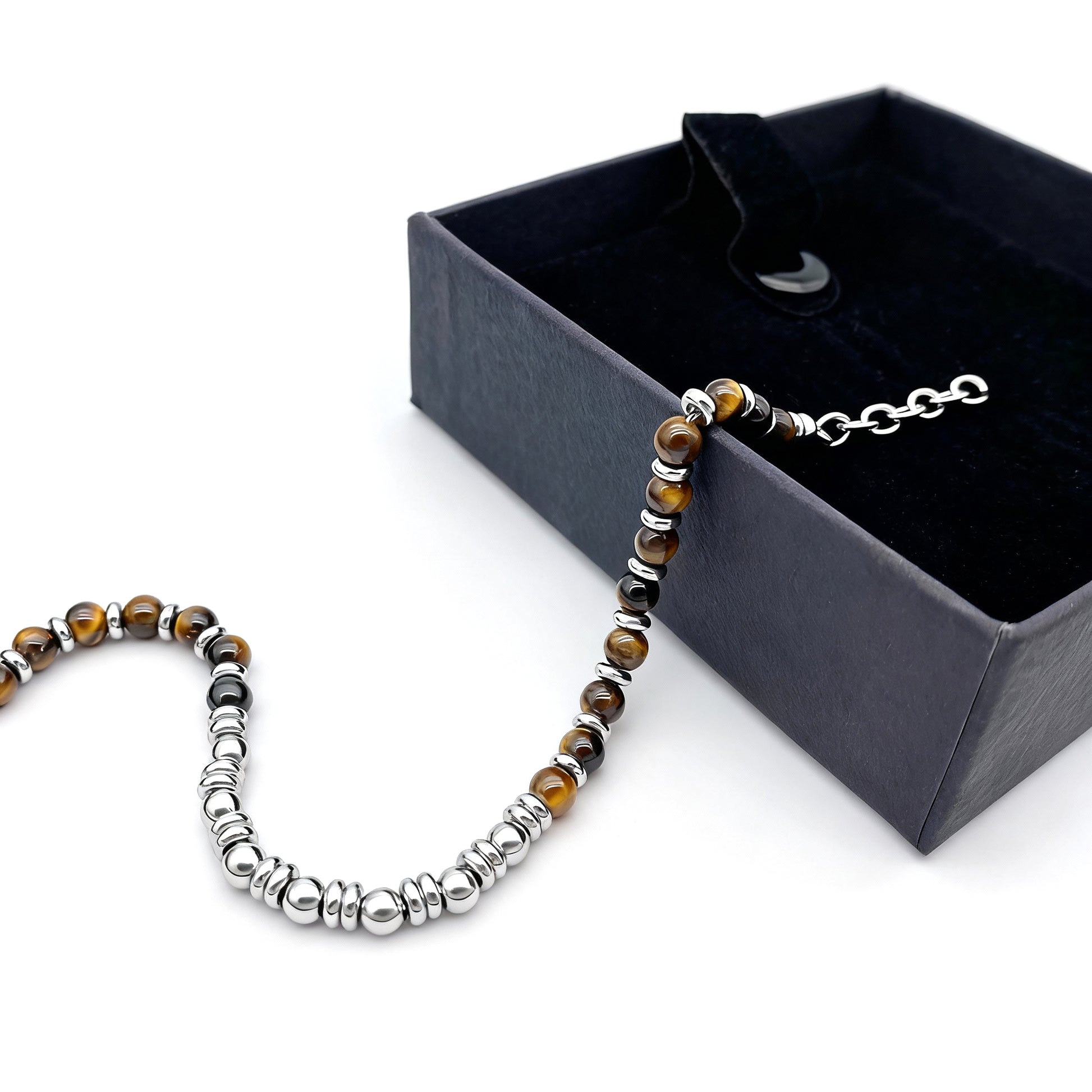 Tiger’s Spirit bracelet elegantly displayed beside a luxury black gift box, combining craftsmanship, meaning, and style.