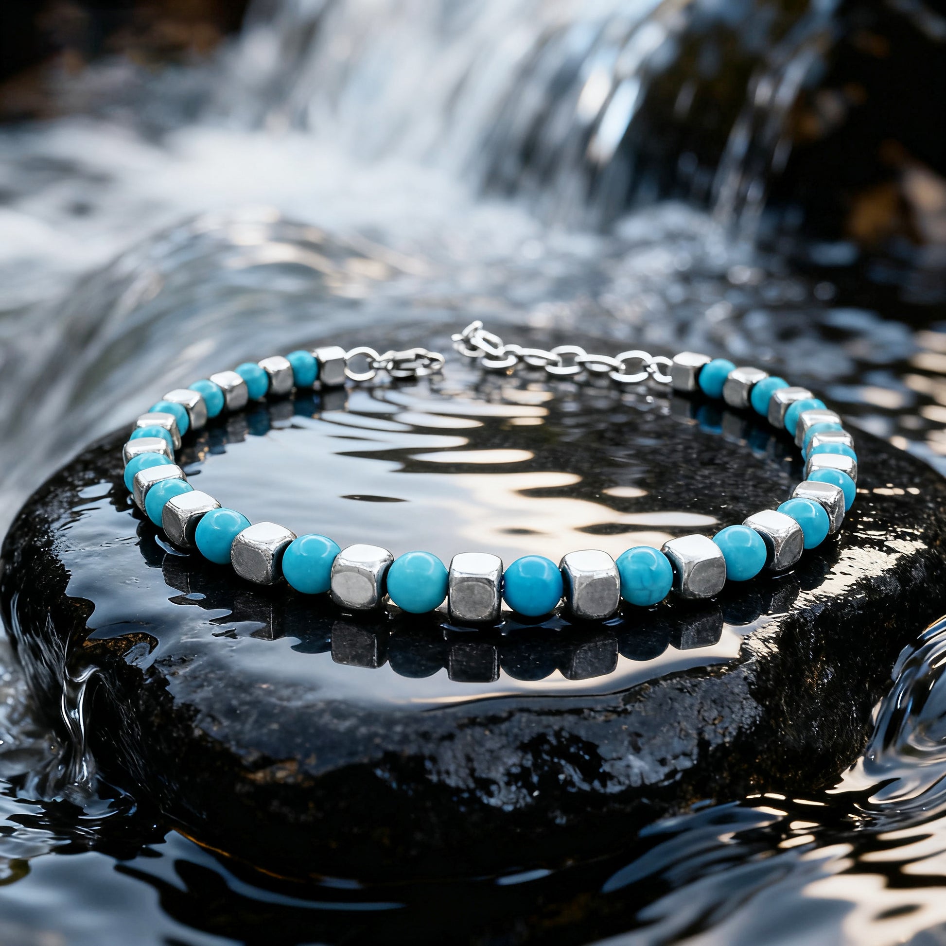 Turquoise Rhythm bracelet displayed on wet rock near flowing water, highlighting the vibrant turquoise stones and sleek silver cube detailing.