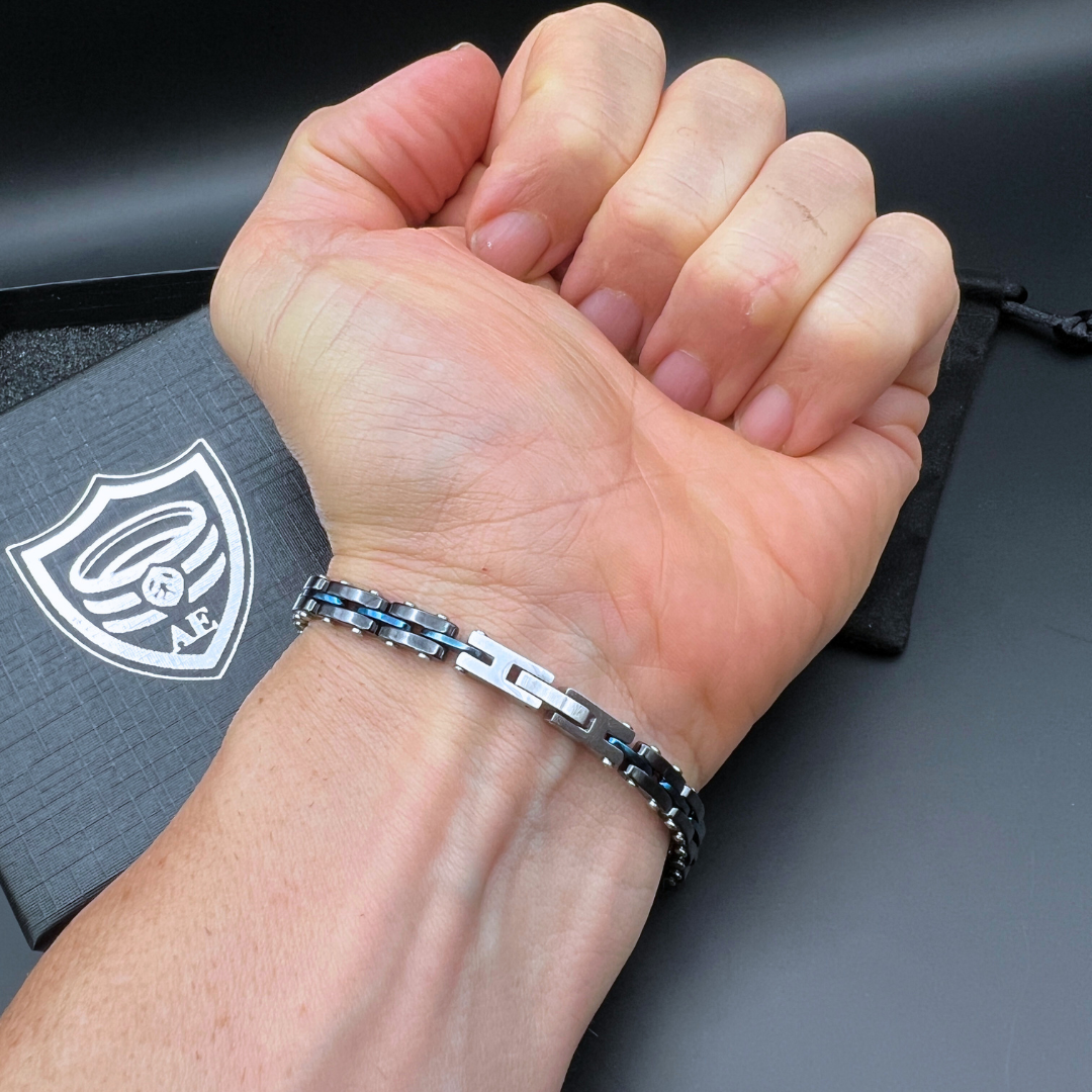 Front shot of Velocity Blue Surge bracelet on wrist highlighting adjustable clasp links.