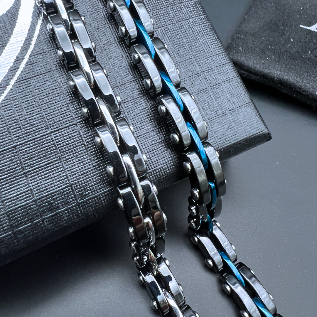 Detailed chain view of Velocity bracelet showing stainless steel and anodised blue accents