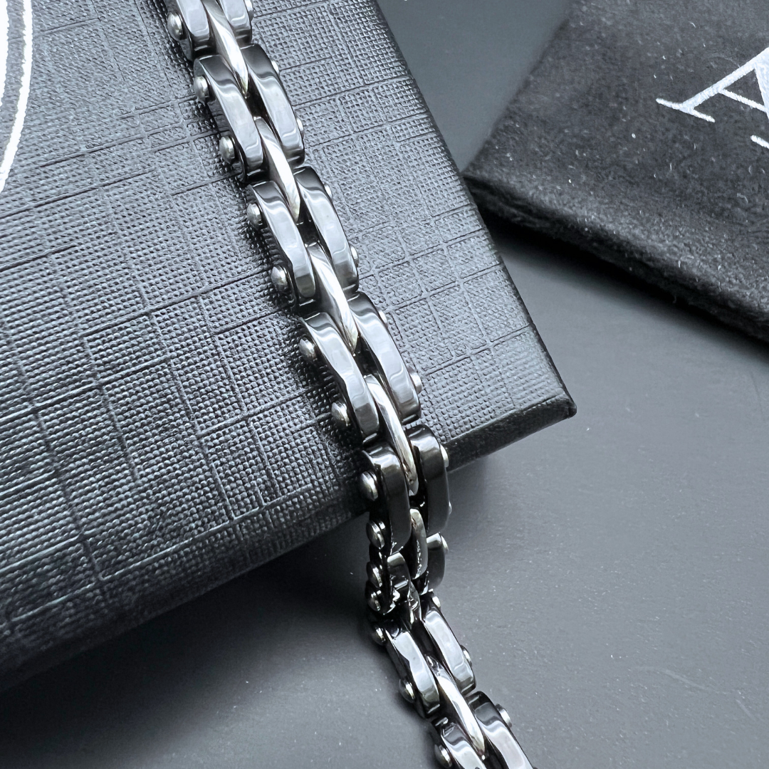 Close-up view of the Velocity Steel Surge bracelet chain links showing the polished stainless steel finish.
