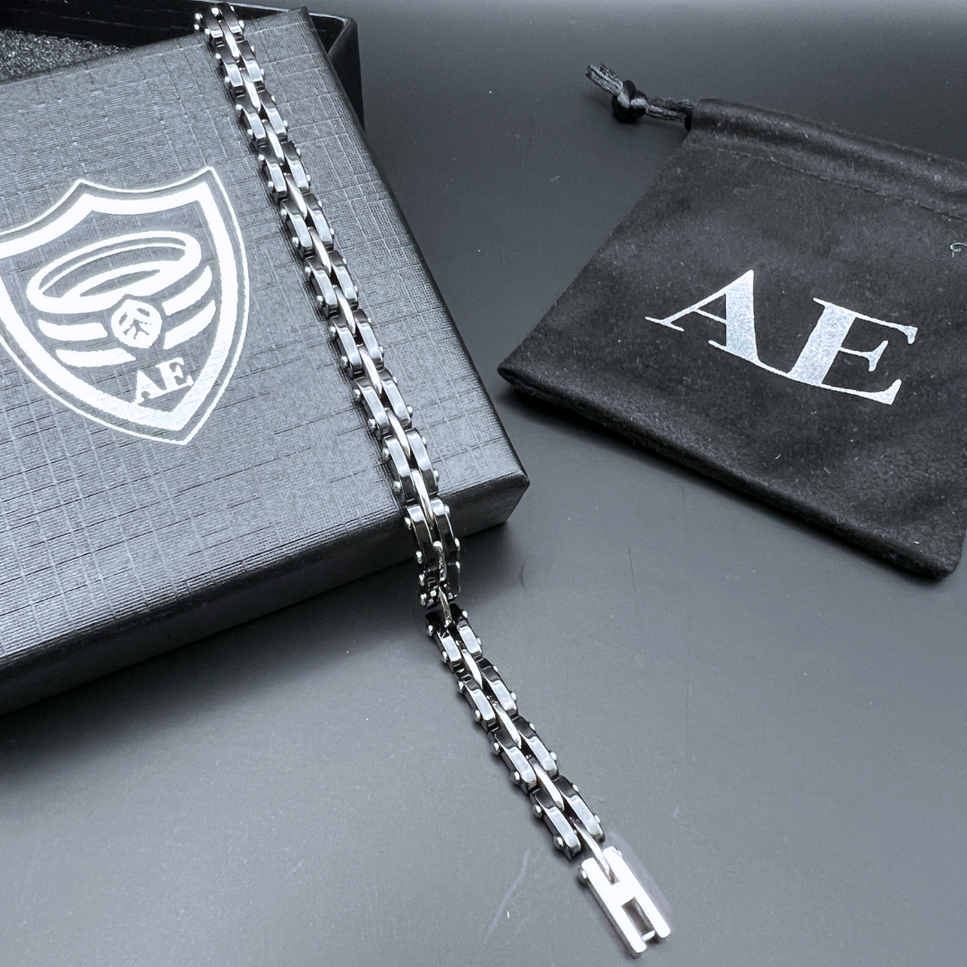 Full view of the Velocity Steel Surge bracelet laid out on Armoured Elegance box and pouch.
