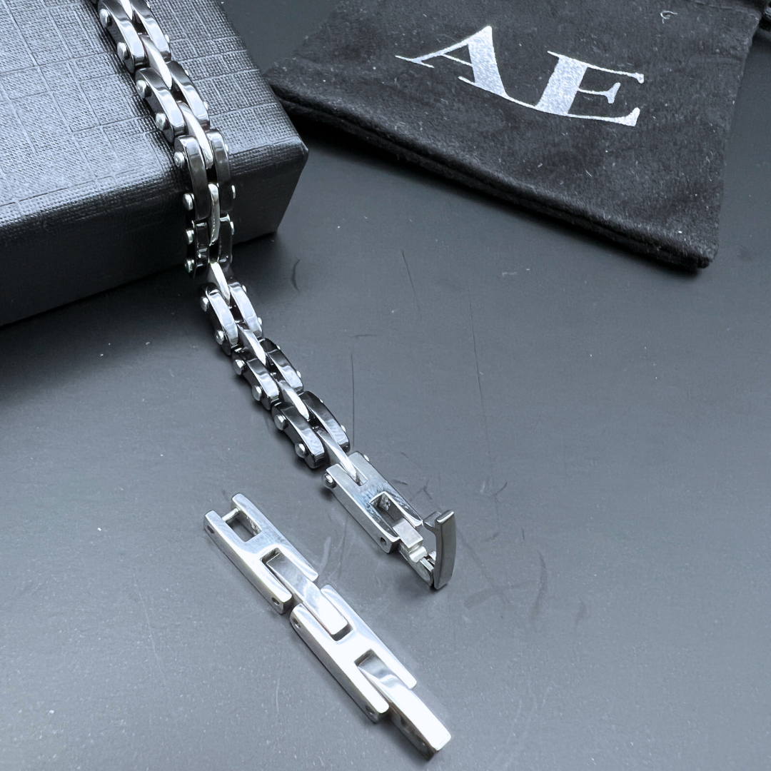Removable link from the Velocity Steel Surge bracelet showing how to adjust the length.