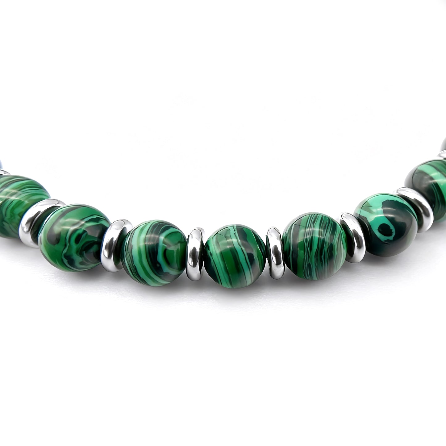 Close-up detail of Verdure bracelet showcasing bright green stone beads and stainless steel spacer rings.