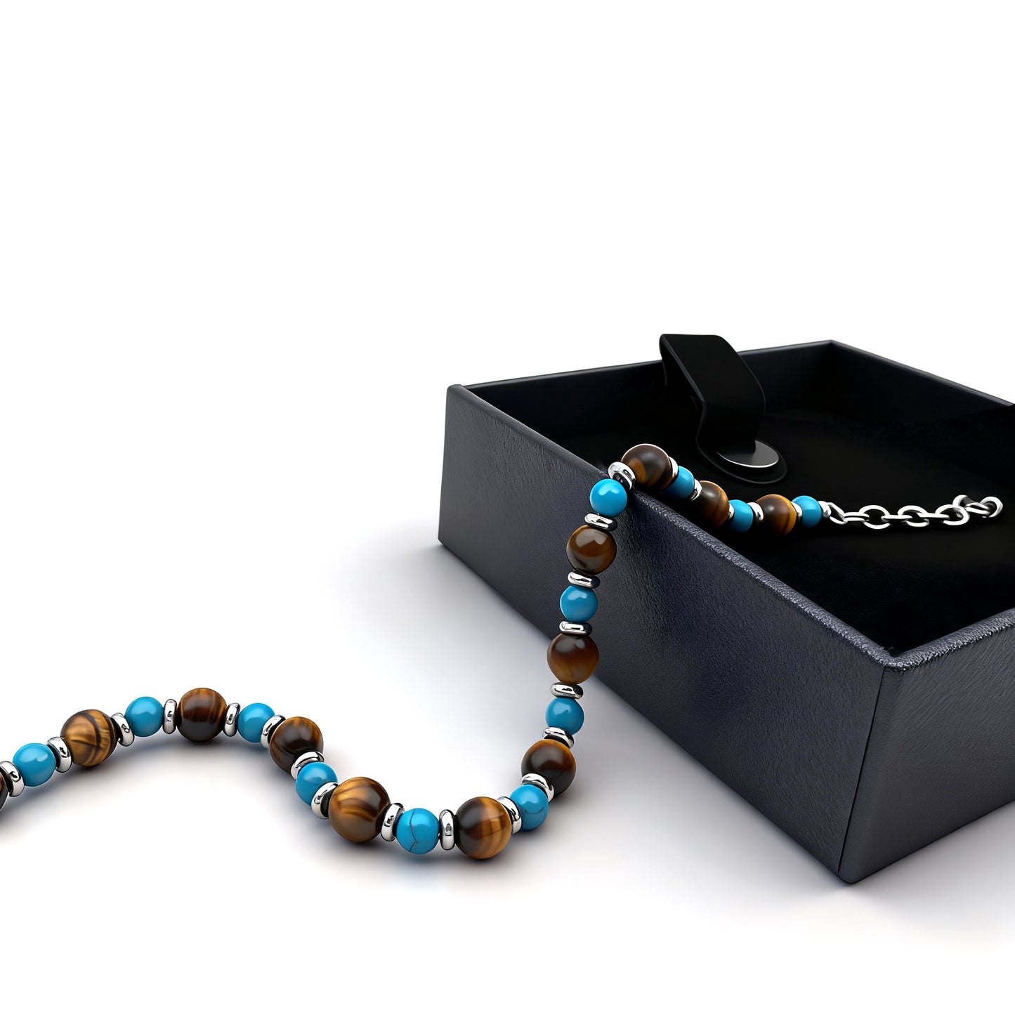 Wild Oasis bracelet featuring turquoise and tiger eye beads draped over a black gift box with stainless-steel clasp for luxury presentation.